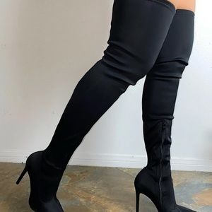 Black thigh high boots very sexy order a size up.